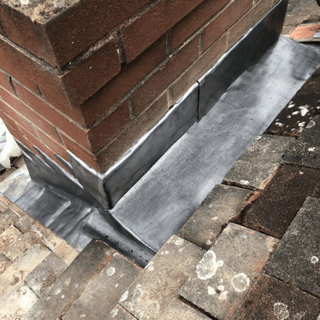Lead at base of chimney stack