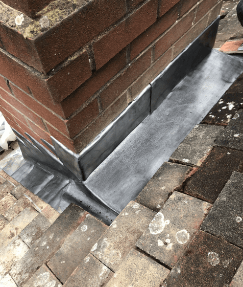 Lead base of chimney stack